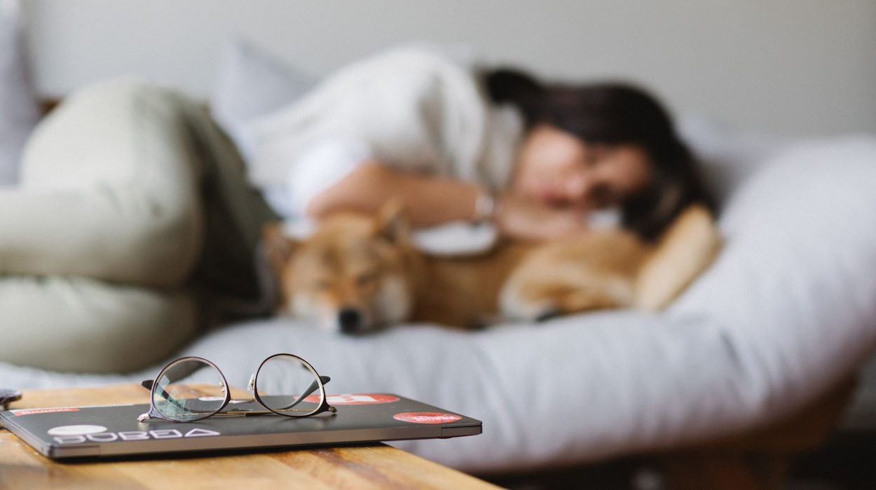 woman sleeping and dog