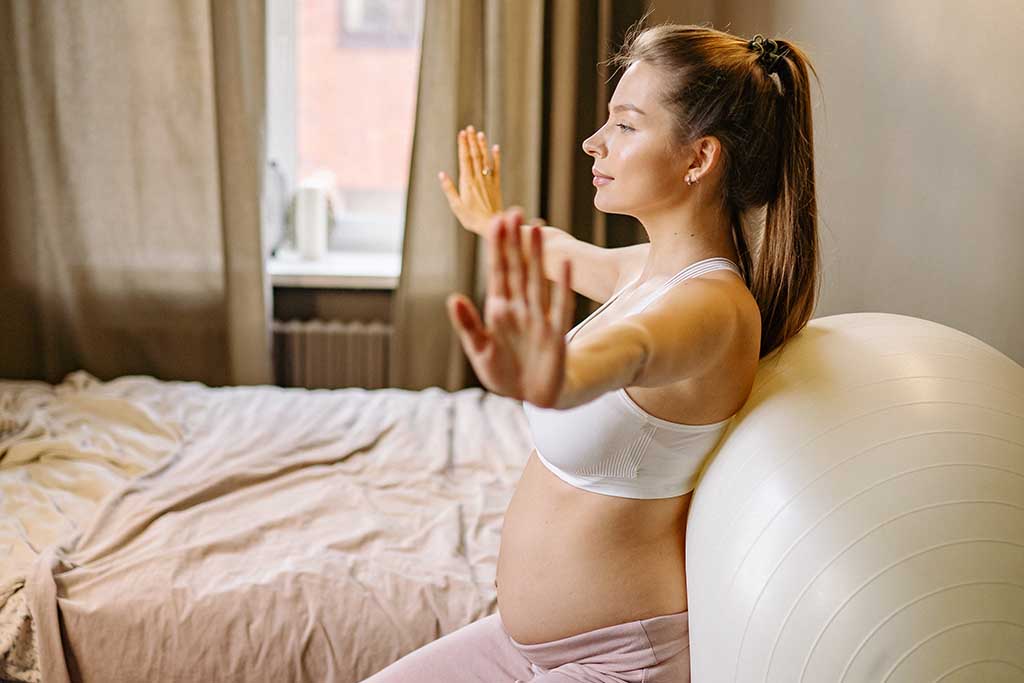 Pregnant woman with exercise ball