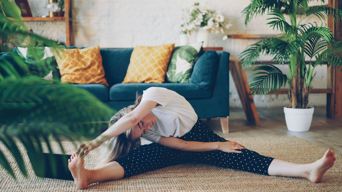 Woman stretching in living room